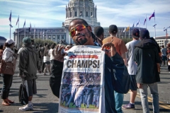 Kareem proudly displays a newspaper with a one word headline - CHAMPS - after the San Francisco Giants won the 2010 World Series
