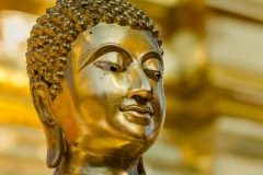 A golden Buddha statue at Wat Doi Suthep in Chiang Mai, Thailand