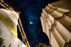 A full moon between the stupas of Wat Chedi Luang on Asanha Bucha Day