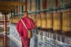 A monk spins a prayer wheel at Wutai Shan in Shanxi, China