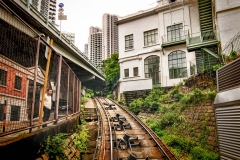 The Victoria Peak Tram runs alongside homes and businesses