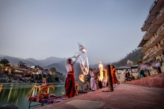 Devotees perform a puja (religious ceremony) alongside the Ganges River in Rishikesh, India