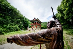 A statue demonstrates sunmudo while you enter the Golgulsa Zen Buddhist Temple in South Korea