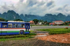 A local bus parked outside the infamous town of Vang Viang in Laos