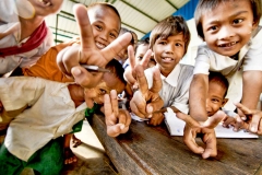 Local children smile for the camera at an orphanage in Dala