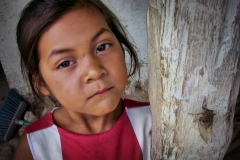 A little girl and her bug in San Gregorio, Nicaragua