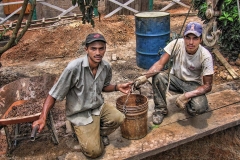 Workers take a break from digging a well in Mina de Plata, Nicaragua