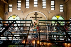 A woman lights prayer candles at the Shrine of our Mother of Perpetual Help (Baclaran Church) in Manila