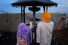 Two devotees pray at a shrine during sunrise on Adam's Peak ... which may or may not be the location of the Garden of Eden