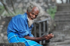 A beggar hopes for a donation at Dambula, Sri Lanka