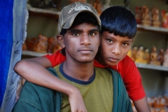 A father-son team sells souvenirs to tourists descending from Adam's Peak