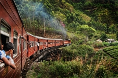 A local train weaves through the hills above Ella in Sri Lanka