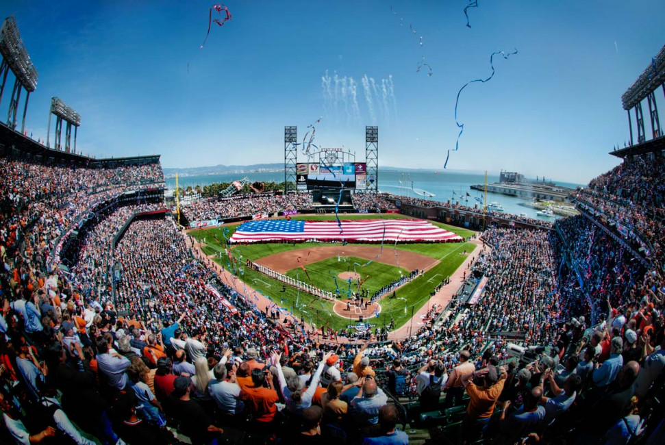 A giant American flag covers center field during the pregame ceremony of the 2010 home opener at AT&T Park