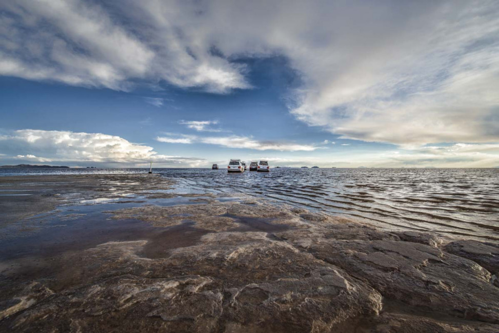 Tourist jeeps drive across the Salar de Uyuni ... aka, the Bolivian Salt Flats