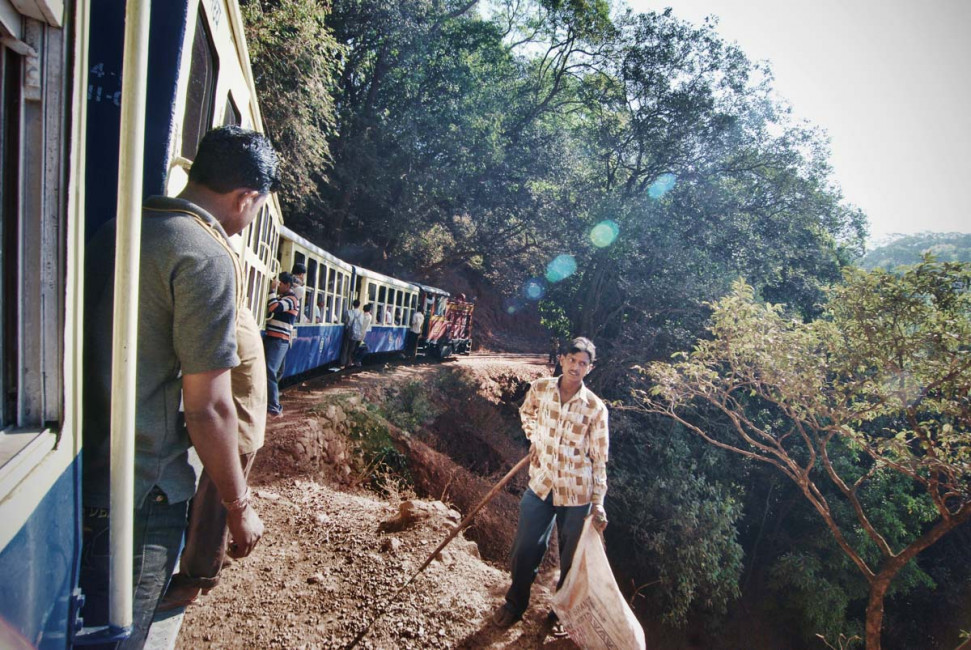 A local train steams through the Matharan hills in central India