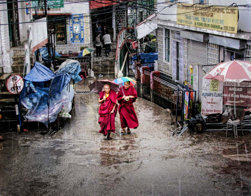 Tibetan monks walk the streets of McLeod Ganj in Dharamshala, India