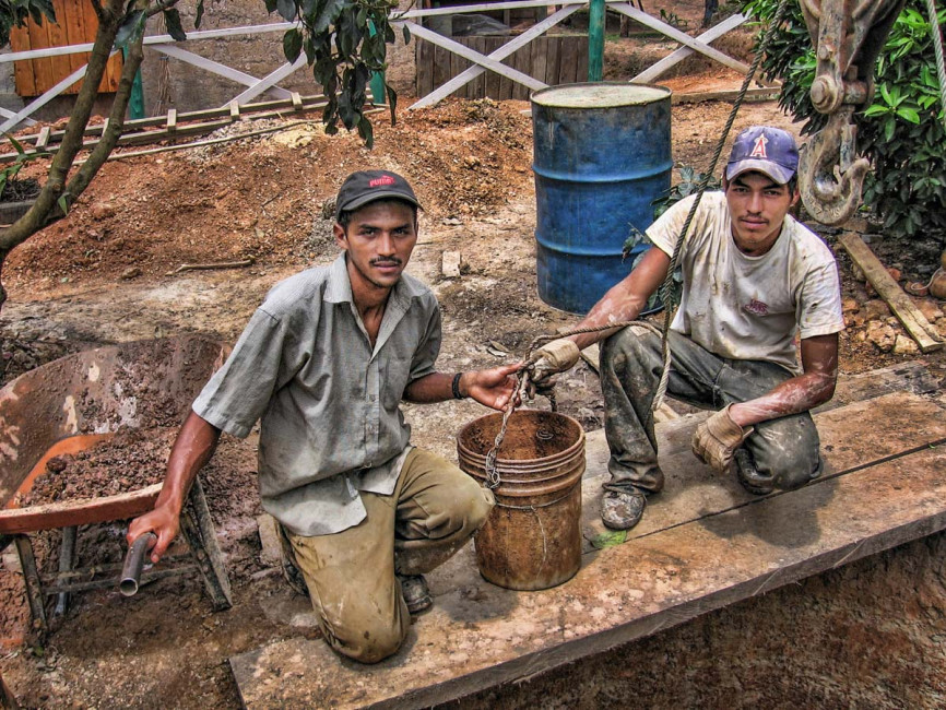 Workers take a break from digging a well in Mina de Plata, Nicaragua