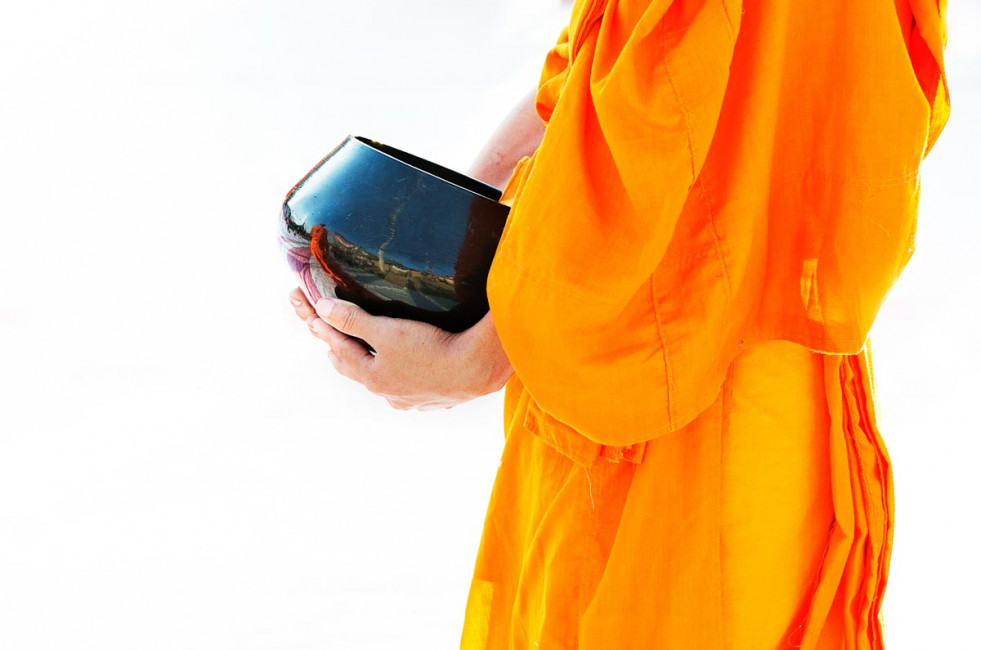 The world reflects in a monk's reflecting bowl during a celebration in Chiang Mai