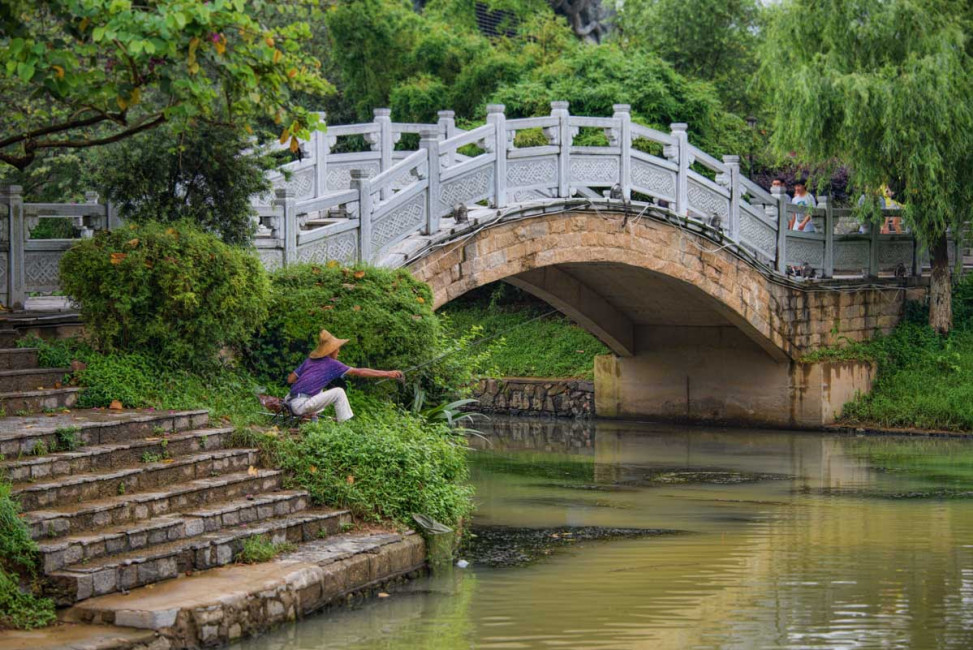 A local fisherman waits for a catch at Elephant Trunk Hill in Guilen, China