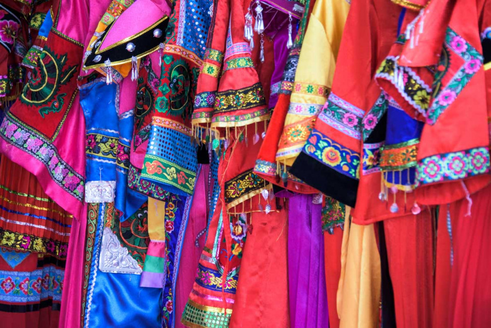 Traditional Chinese outfits for sale in a market in Quingyan Ancien Town