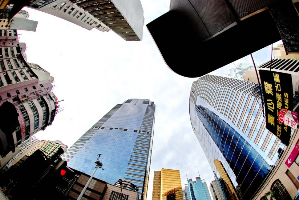 Looking up at the massive skyscrapers of downtown Hong Kong