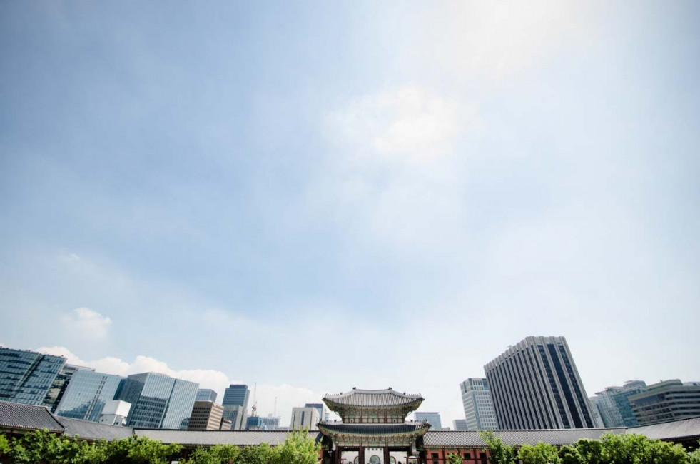 The ancient (though rebuilt) Gyeongbokgung Palace is surrounded by a modern metropolis in Seoul, South Korea