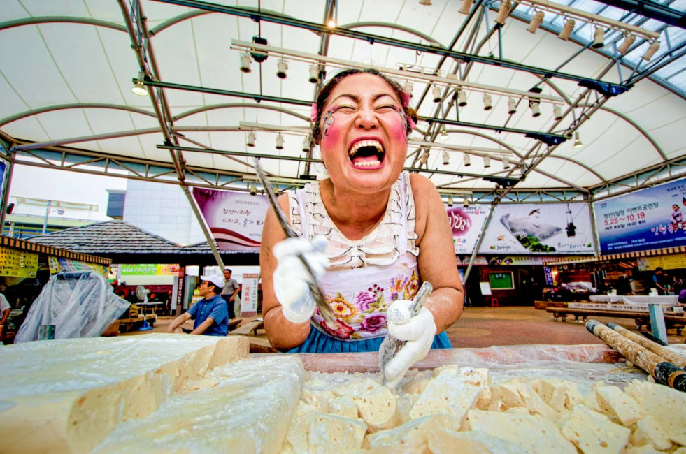 The Taffy Lady gives out free samples and smiles at the Jeongson-O-Il 5 Days Market in South Korea