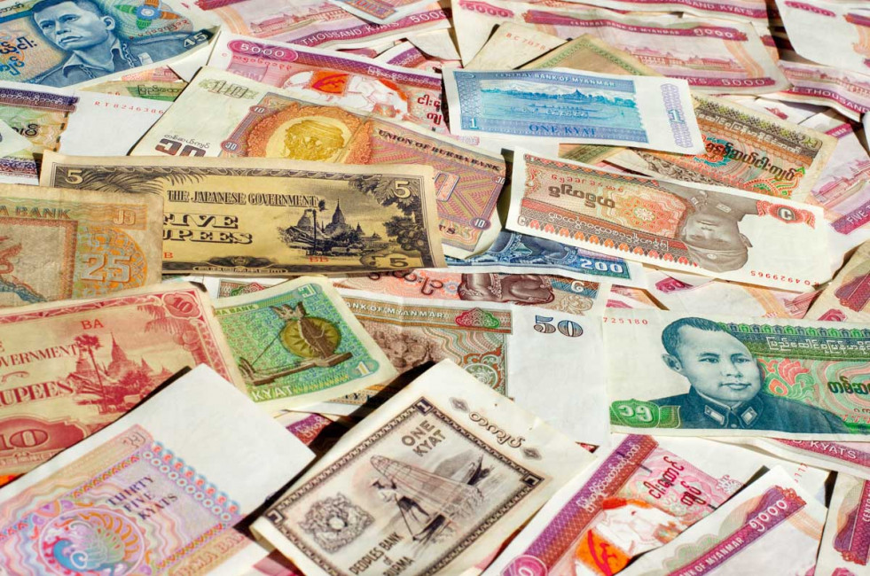 A collage of old and new Burmese currency, which is known as the Kyat