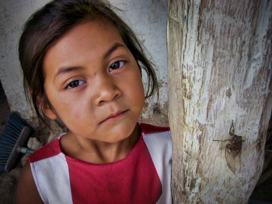 A little girl and her bug in San Gregorio, Nicaragua