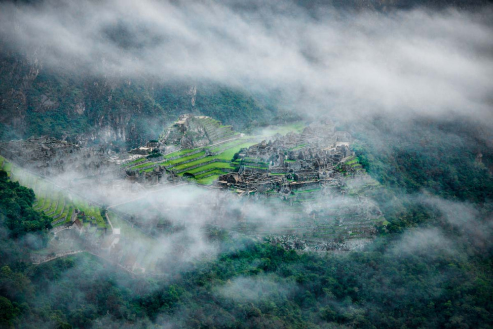 A cloudy morning view of Machu Picchu from the Sun Gate on the Inca Trail