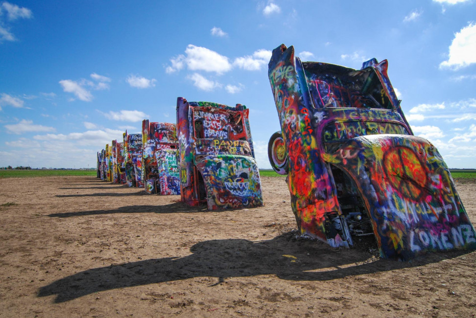 Old Caddies stick up out of the desert at the Cadillac Ranch in Amarillo, TX