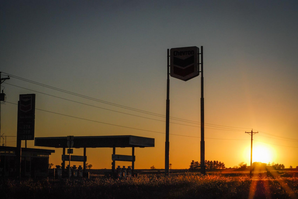 Sunset behind a Chevron gas station on the Texas roadside