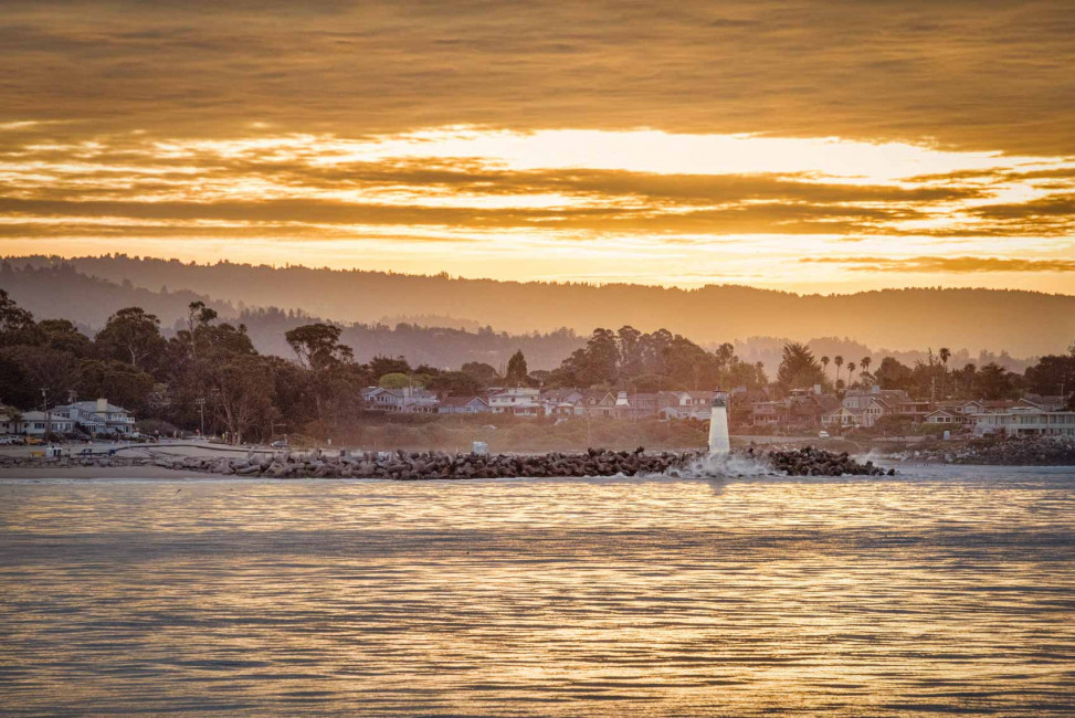 Sunset behind Walton Lighthouse and the Santa Cruz mountains