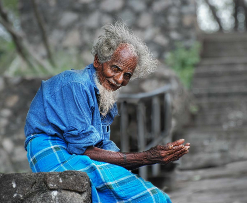 A beggar hopes for a donation at Dambula, Sri Lanka