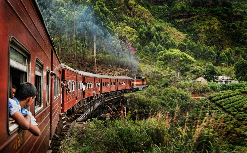 A local train weaves through the hills above Ella in Sri Lanka