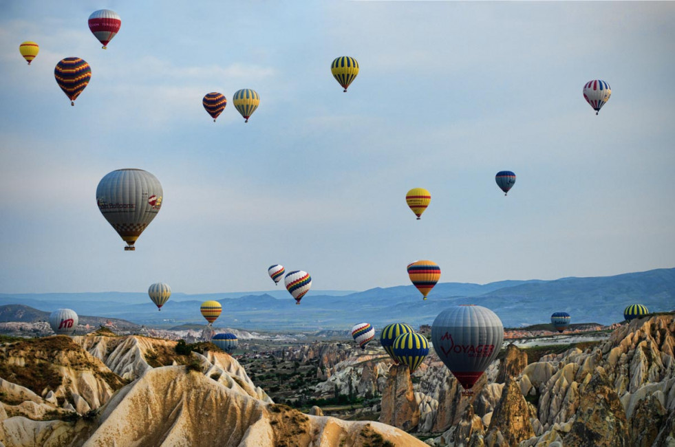 A hot air balloon ride is one of the most scenic and iconic ways to spend sunrise in Kapadokya