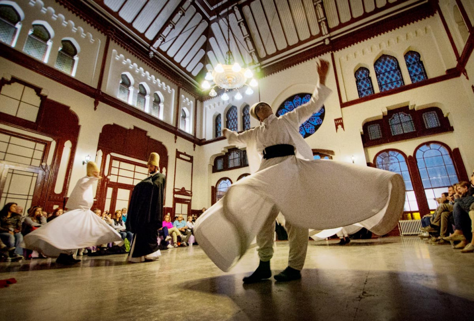 Traditional Whirling Dervishes perform daily for tourists at the Serkeci Train Station in Istanbul, Turkey