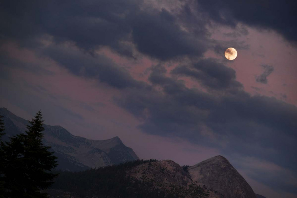 A full moon rises above Yosemite National Park