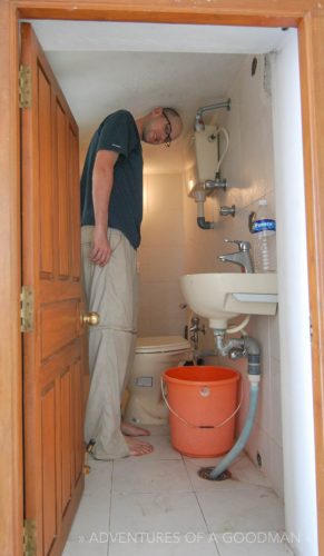 Trying to fit into the teeny bathroom in our hotel in Puducherry