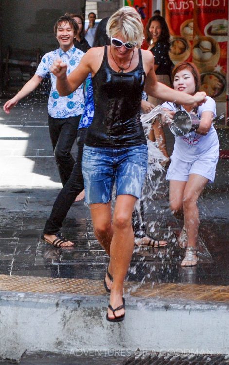 Splashing tourists during Songkran in Bangkok, Thailand