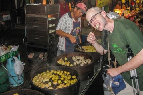 Eating pork dumplings in Melaka, Malaysia