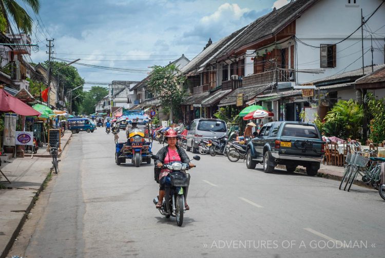 A motorcycle ... amongst other vehicles ... on the streets of Louang Phabang, Laos