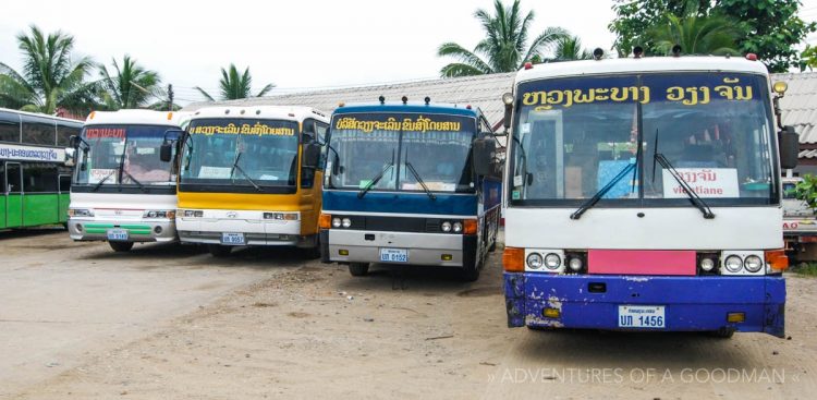 Public buses lined up at a station in Laos