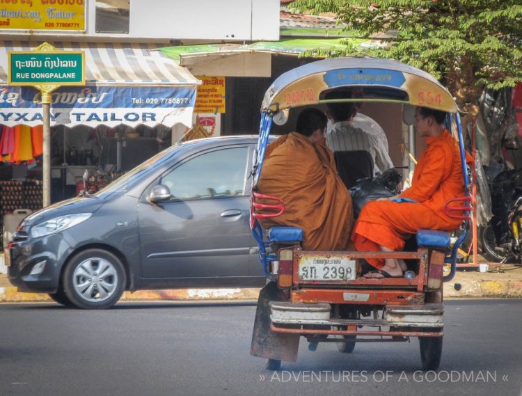 Monks in the back of a Laotian tuk tuk in Vientiane