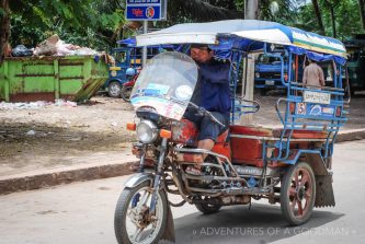 A tuk tuk waits for a fare in Laos