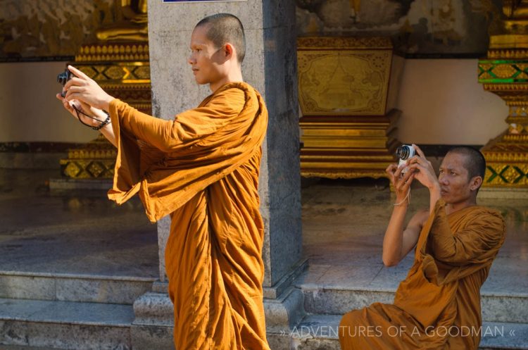 Monks taking photos at Wat Doi Suthep in Chiang Mai, Thailand