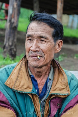 A local man smokes in a small village above Chiang Mai, Thailand