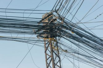 A jumble of electric wires alongside the Mekong River in Phnom Penh, Cambodia