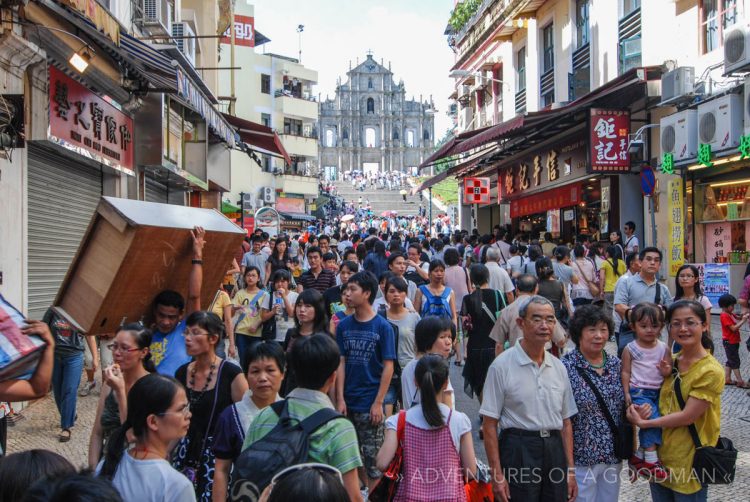 Tourists flock to the ruins of Saint Paul's Cathedral in historic Macau