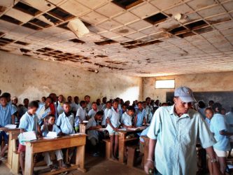 A headmaster tends his classroom in Madagascar, Africa